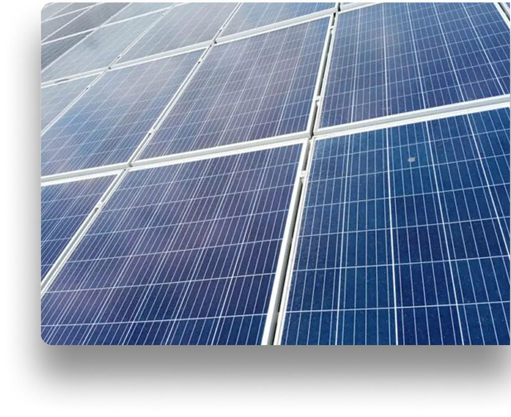 A series of blue solar panels installed on a flat surface, reflecting sunlight. The panels are arranged in a grid pattern, capturing solar energy. The background is not visible.