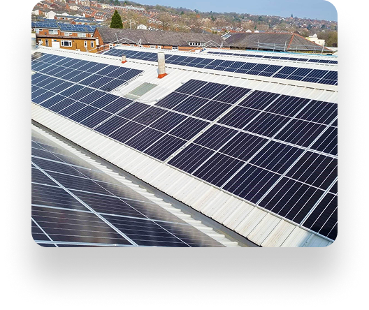 Rooftop with TBE Precision solar panels stands out against suburban homes and trees, under a clear sky suggesting a sunny, efficient day.