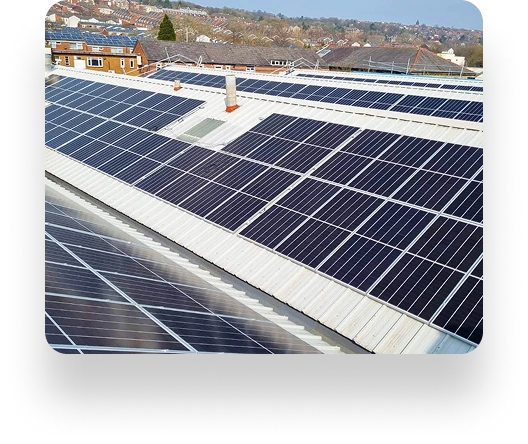 Rooftop with TBE Precision solar panels stands out against suburban homes and trees, under a clear sky suggesting a sunny, efficient day.