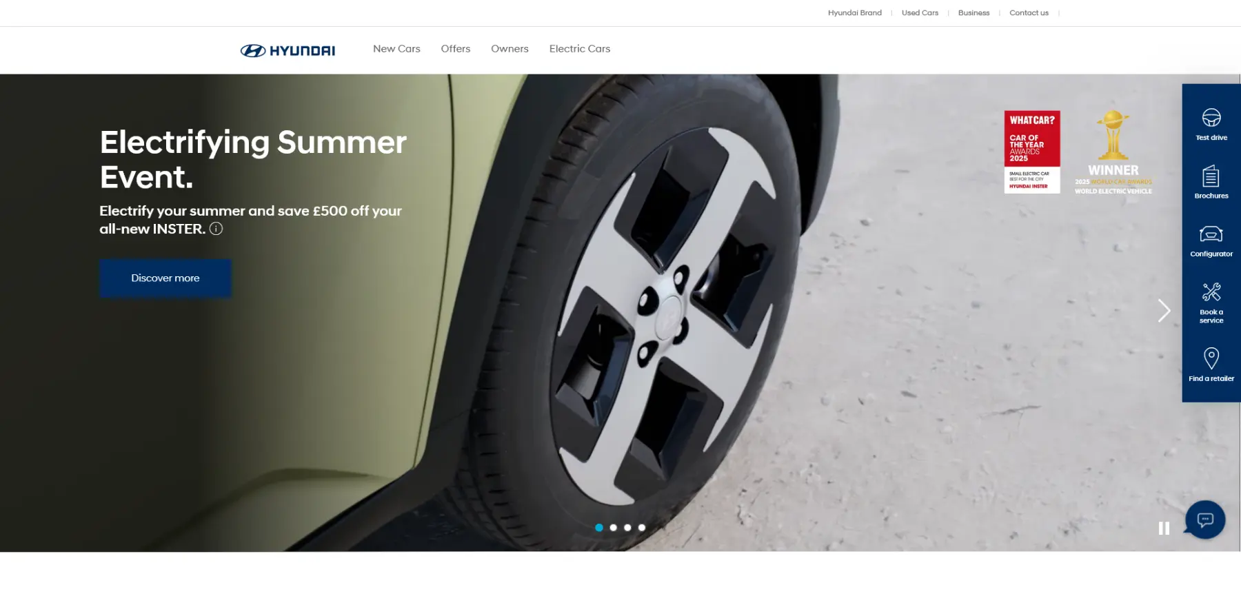 Hyundai promotional banner for the Electrifying Summer Event, offering £500 off the all-new INSTER with award logos and menu navigation.