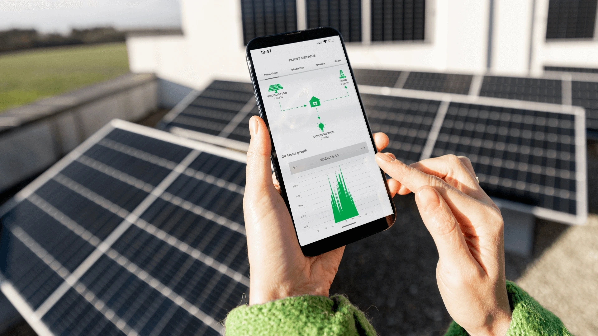 Image of solar panels with a mobile application solar energy tracker.