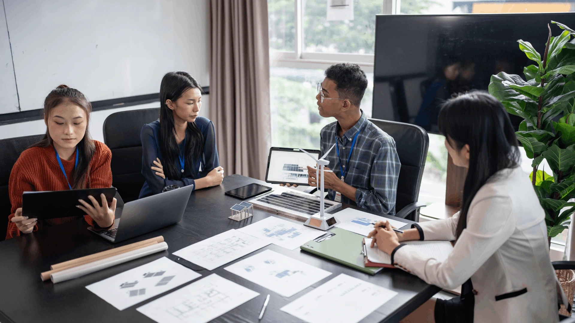 Team members discussing project plans and strategies during a meeting.